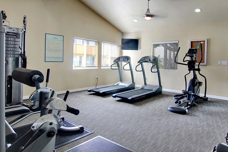 Fitness center with exercise equipment.
