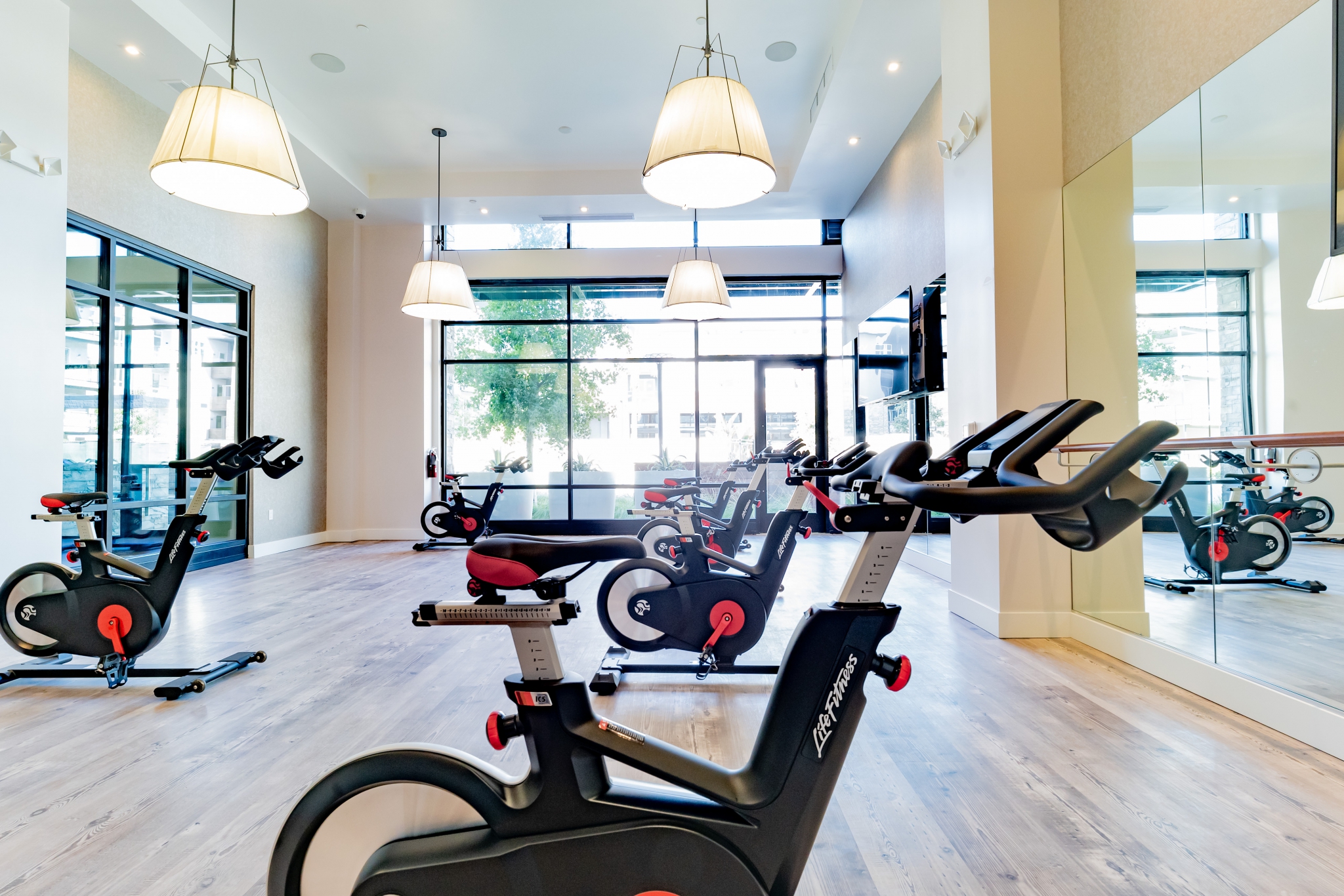 Spacious workout room with spin bikes